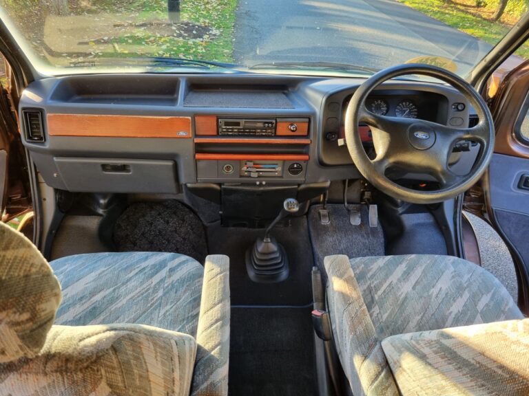 Shelby driving cab with a manual gear lever and right-hand steering wheel