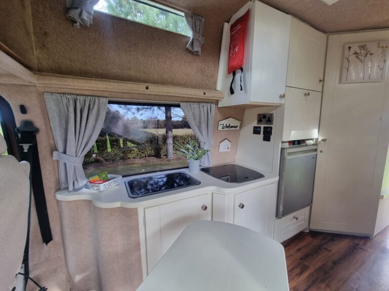 Warrior kitchen cupboards with hob, sink and fridge