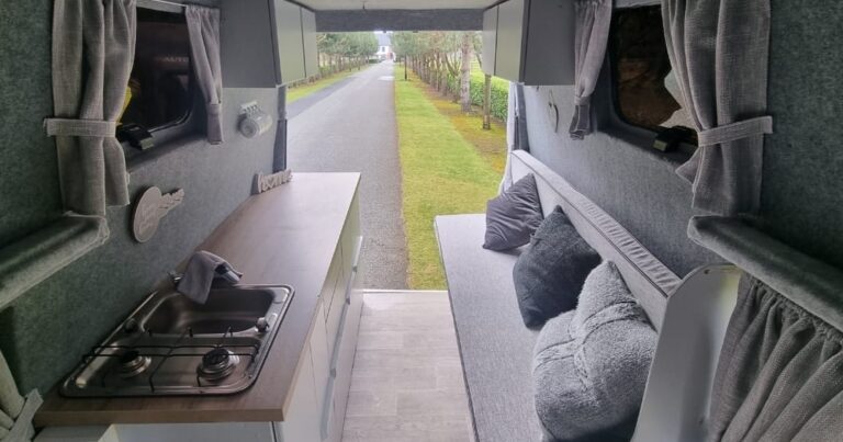 Betsy kitchen and bench seating viewed towards the open rear doors