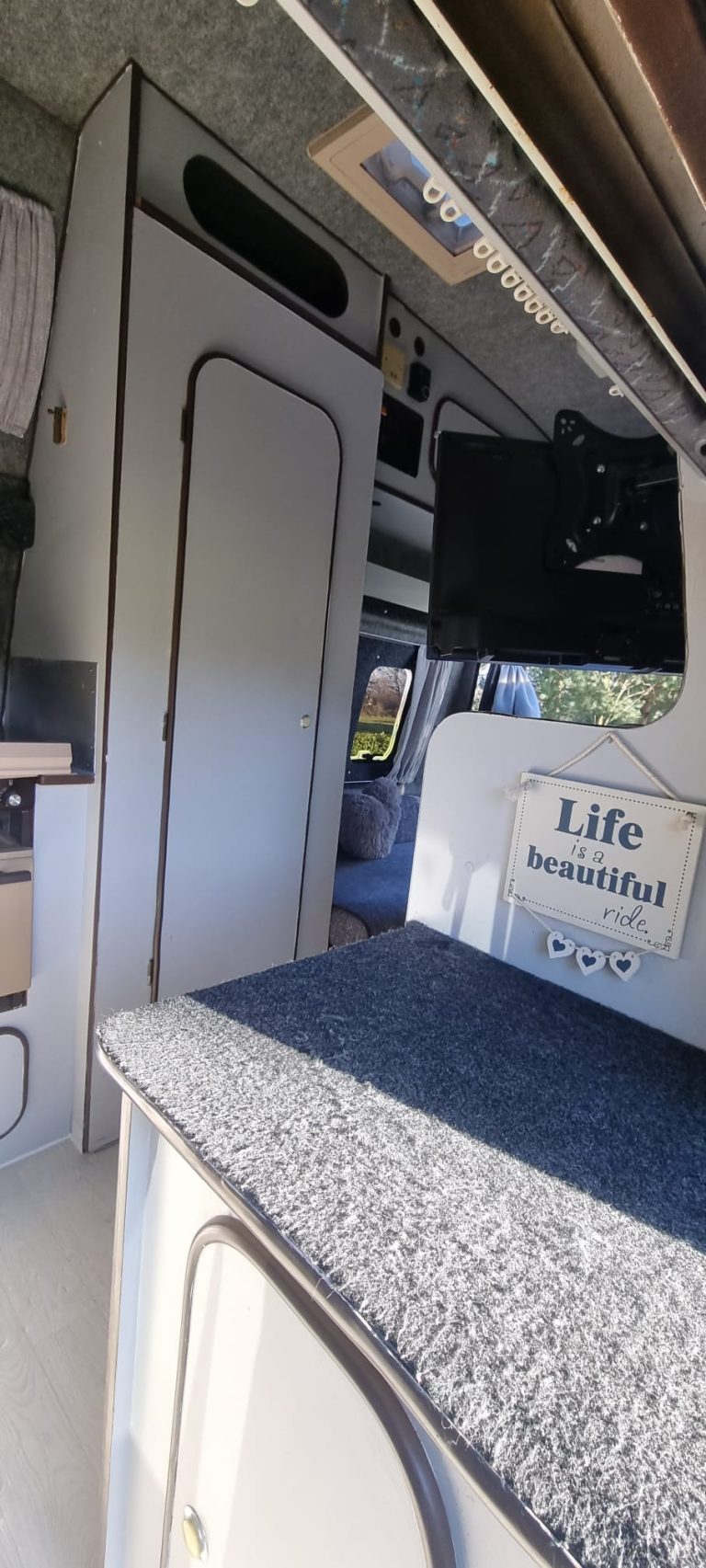 Bertha lounge seating beside storage cupboards