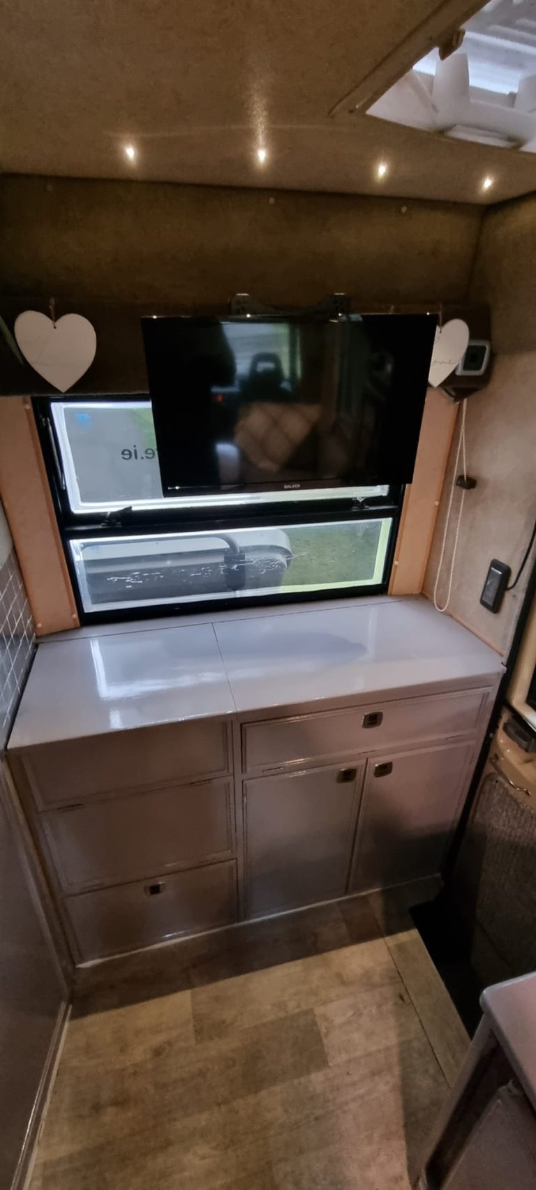 Avondale rear kitchen cupboards beneath the window