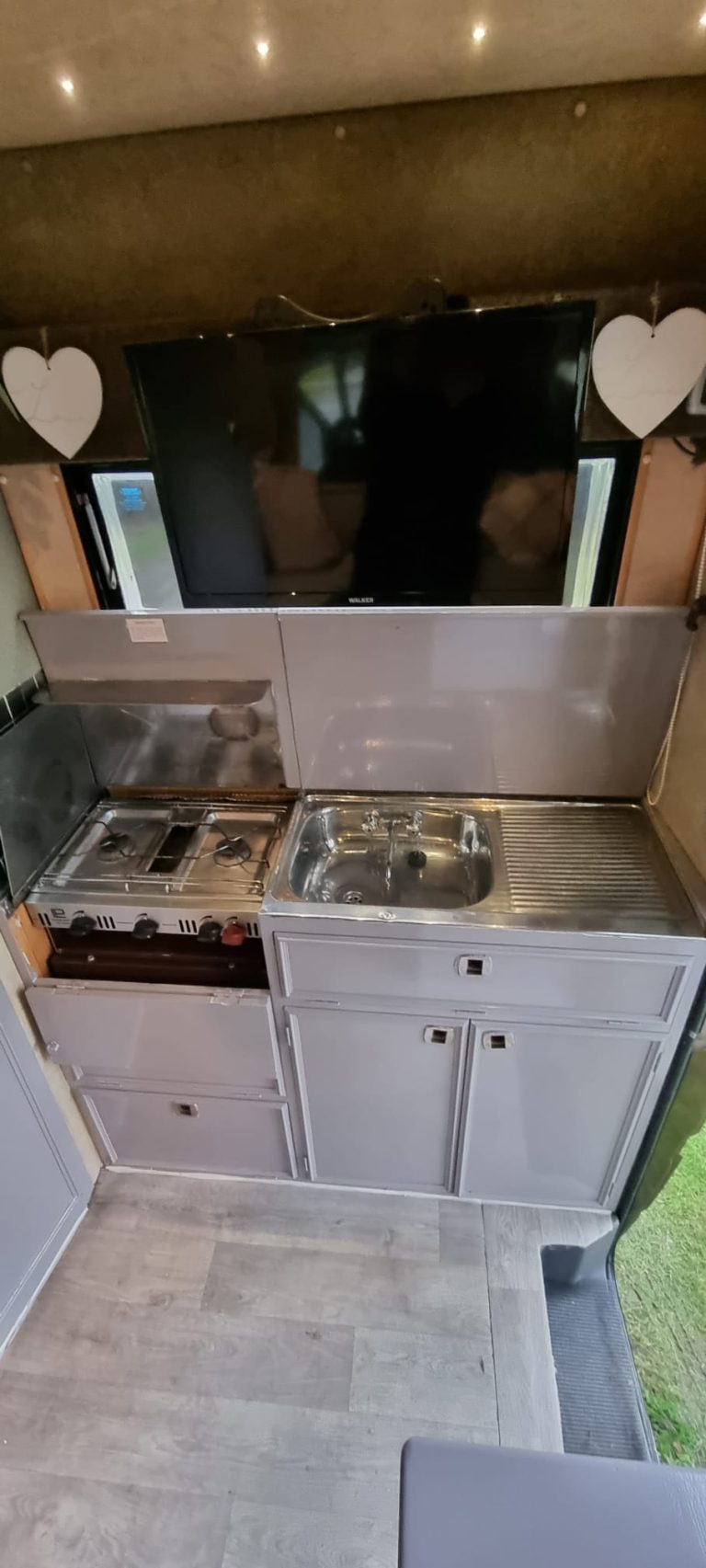 Avondale rear kitchen with gas hob, sink and cupboards