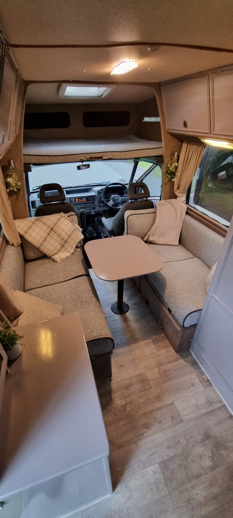 Avondale lounge with a dining table and facing bench seats