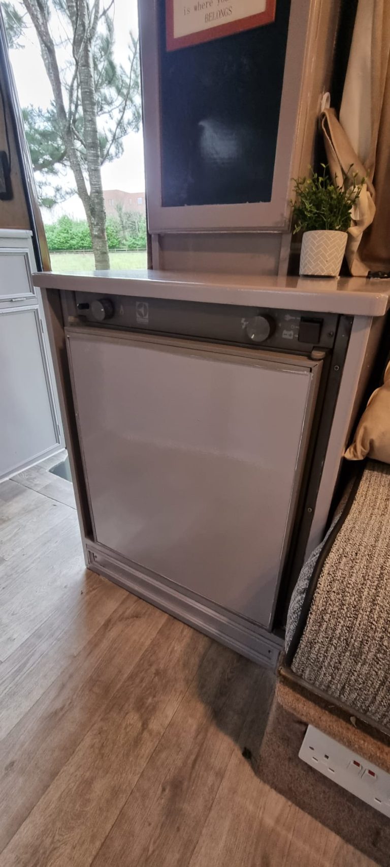 Avondale under-counter fridge beside the lounge