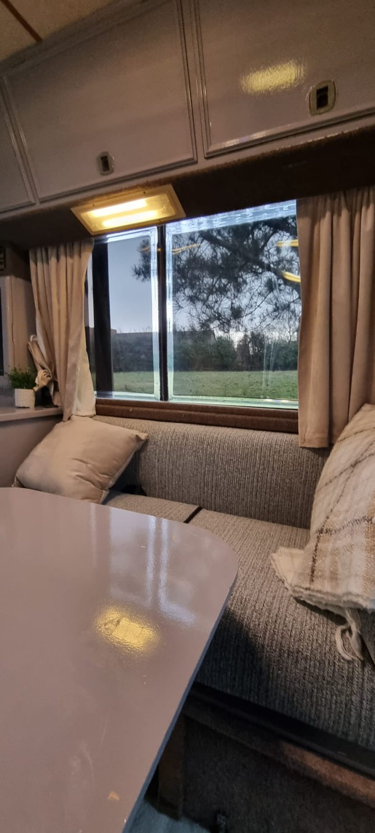 Avondale dining table beside the window