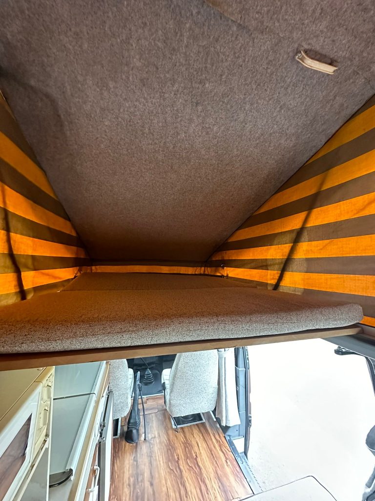 Scooby upper sleeping platform beneath the pop-top