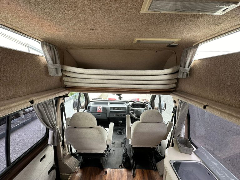 Warrior front seats beneath the upper sleeping platform