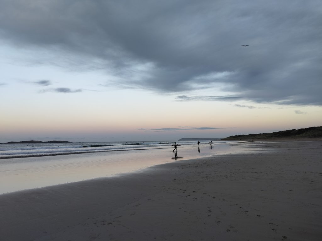 Surfers on East Strand Beach Portrush Northern Ireland